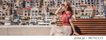 BANNER, LONG FORMAT Woman tourist enjoying the views of Architecture and luxury yachts in Lustica Bay, Montenegro. Travel around Montenegro concept. Go Everywhere BANNER, LONG FORMAT Woman tourist enjoying the views of Architecture and luxury yachts in Lustica Bay, Montenegro. Travel around Montenegro concept. Go Everywhere 96742215