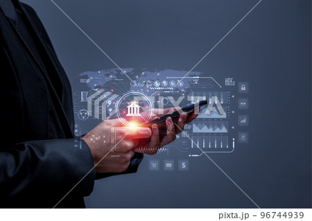 Business people using mobile phone to conduct financial transactions through internet all over the world. Concept of cyber banking services for financial transactions, investments through internet. Business people using mobile phone to conduct financial transactions through internet all over the world. Concept of cyber banking services for financial transactions, investments through internet. 96744939