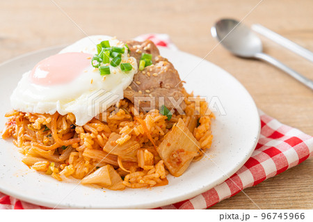 Kimchi fried rice with fried egg and pork Kimchi fried rice with fried egg and pork 96745966
