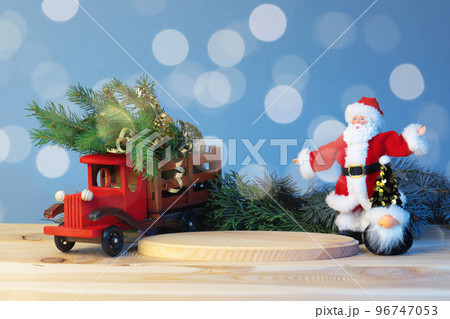 Christmas pedestal for the product, still life composition, with a New Year's car, with a Christmas tree in the back, Santa Claus meets the new year with a bunny, mockup 96747053