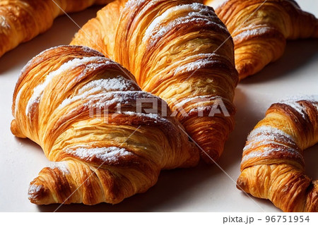 Delicious French croissant in powdered sugar for breakfast Delicious French croissant in powdered sugar for breakfast 96751954