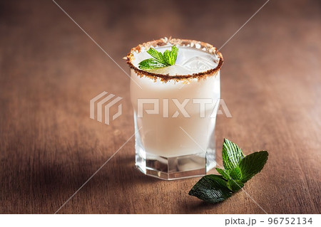 Cracked coconut fruit pieces with glass of coconut milk 96752134