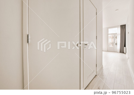 Interior of empty white kitchen with windows and wooden parquet floor 96755023