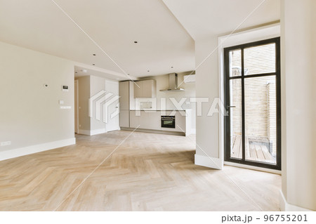 Interior of empty white kitchen with windows and wooden parquet floor Interior of empty white kitchen with windows and wooden parquet floor 96755201