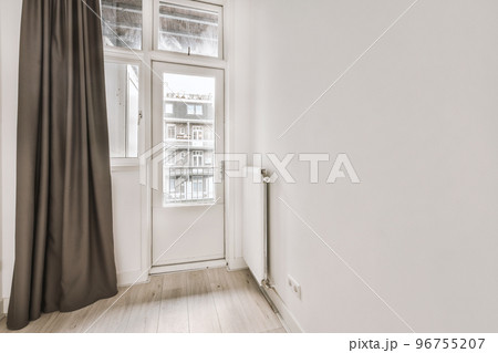 Plastic window and radiator on white wall in empty light room at home Plastic window and radiator on white wall in empty light room at home 96755207