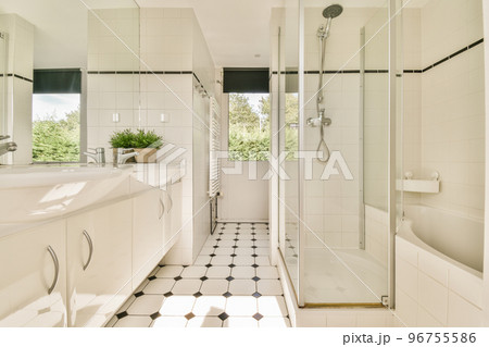 Glass partition between shower tap and wall hung toilet in modern restroom at home Glass partition between shower tap and wall hung toilet in modern restroom at home 96755586