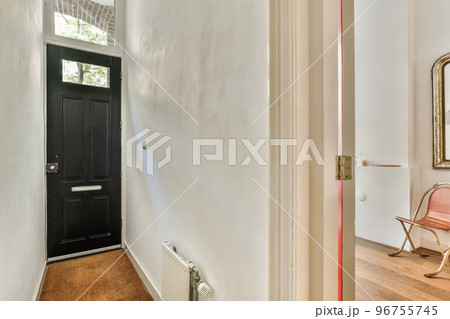 Interior of narrow corridor with radiator in daylight 96755745