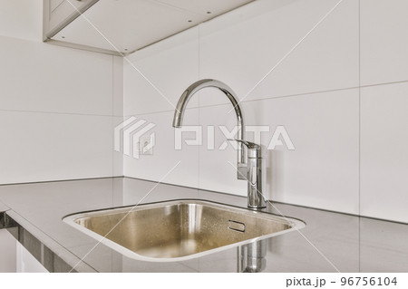 Interior of empty white kitchen with windows and wooden parquet floor 96756104