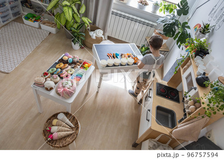 Baby boy playing cafe kitchen cashier payment counting use cash register counter early development Baby boy playing cafe kitchen cashier payment counting use cash register counter early development 96757594