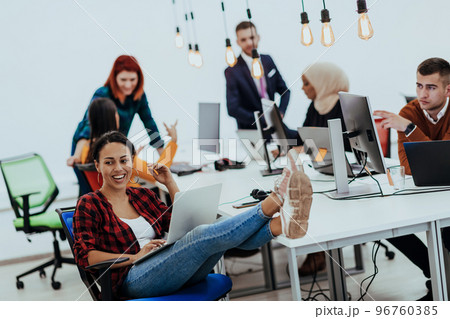 Multiethnic group of employees working in a marketing company. A group of colleagues is working on a project in modern offices Multiethnic group of employees working in a marketing company. A group of colleagues is working on a project in modern offices 96760385