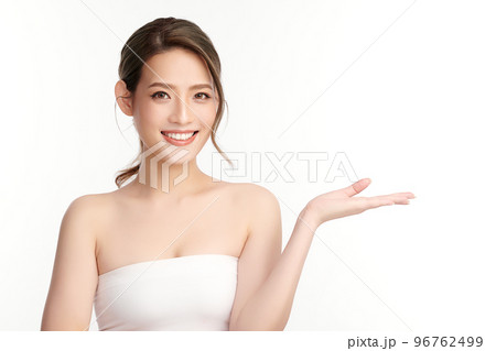 Asian Young Woman With Tube Foundation On Face Isolated On White