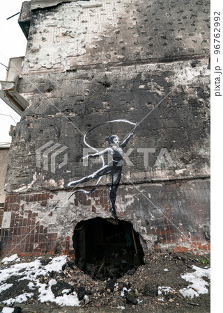 Ukraine, Irpin - Banksy graffiti on the wall of a house 96762992