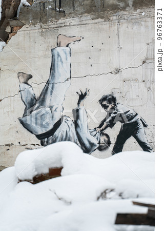 Banksy graffiti on a wall in Borodyanka, Ukraine Banksy graffiti on a wall in Borodyanka, Ukraine 96763371