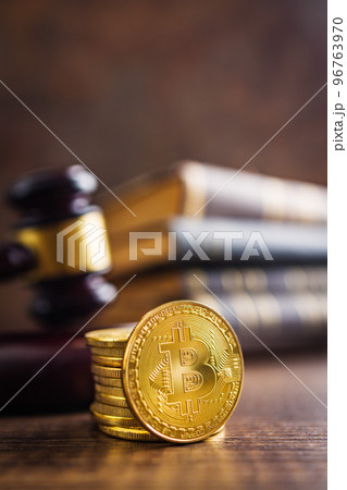 Cryptocurrency. Bitcoin virtual money. Golden coins and judge gavel. Cryptocurrency. Bitcoin virtual money. Golden coins and judge gavel. 96763970