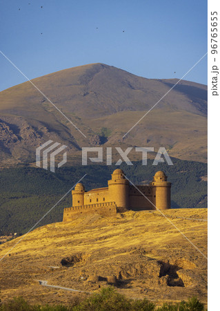 La Calahorra castle with Sierra Nevada, Andalusia, Spain La Calahorra castle with Sierra Nevada, Andalusia, Spain 96765655