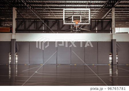 Basketball courts on rooftop of Parking lot building. View of Basketball fiberglass backboard. Basketball courts on rooftop of Parking lot building. View of Basketball fiberglass backboard. 96765781