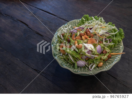 Wings Bean Spicy Salad (Yum-Tua-Phuu) on green ceramic. Authentic thai food. Wings Bean Spicy Salad (Yum-Tua-Phuu) on green ceramic. Authentic thai food. 96765927