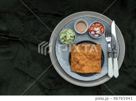 Crispy vietnamese savory crepe with prawns (Vietnamese stuffed crispy omelette or Stuffed crispy egg crepe). Crispy vietnamese savory crepe with prawns (Vietnamese stuffed crispy omelette or Stuffed crispy egg crepe). 96765941