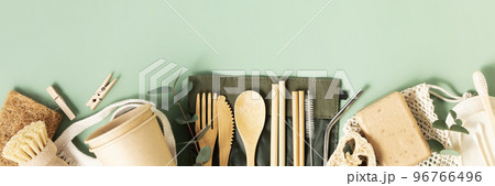 Banner Set of eco-friendly tableware and cleaning products on pastel green background, flat lay stop plastic pollution 96766496