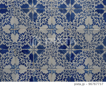 Blue ceramic tiles from facade of old houses in Lisbon Portugal. Portuguese traditional Azulejos decorative artistic design background, creative texture surface 96767737
