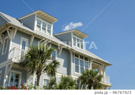 Low angle view of a house with light blue wood sidings and white trims at Destin, Florida Low angle view of a house with light blue wood sidings and white trims at Destin, Florida 96767925