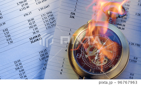 Burning pocket watch and operating budget numbers of financial calculation Burning pocket watch and operating budget numbers of financial calculation 96767963