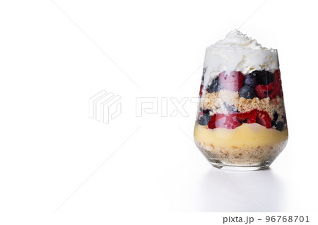 Trifle dessert with berries and cream isolated on white background Trifle dessert with berries and cream isolated on white background 96768701
