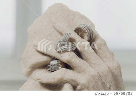 white figurines with wedding rings on close-up. white figurines with wedding rings on close-up. 96769705