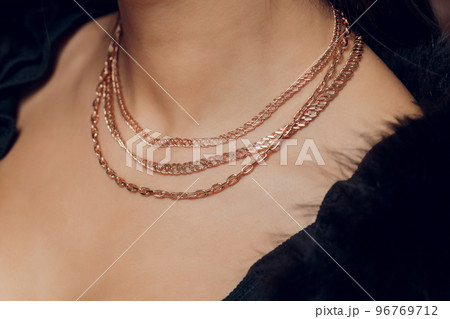 Close up Detail of a Beautiful Necklace in Glamour Shot - Image of a beautiful precious piece around model s neck. Close up Detail of a Beautiful Necklace in Glamour Shot - Image of a beautiful precious piece around model s neck. 96769712