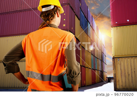 Woman works as a warehouse worker in a cargo warehouse 96770020