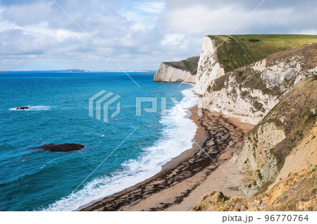 Beautiful views of nature on way to Durdle door in Lulworth, Dorset, United Kingdom. Part of Jurassic Coast World Heritage Site, view of white cliffs and blue sea, selective focus Beautiful views of nature on way to Durdle door in Lulworth, Dorset, United Kingdom. Part of Jurassic Coast World Heritage Site, view of white cliffs and blue sea, selective focus 96770764