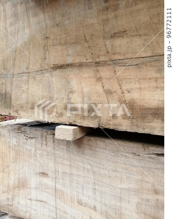 Work in an industrial warehouse. natural wood blocks in lumberyard Work in an industrial warehouse. natural wood blocks in lumberyard 96772111