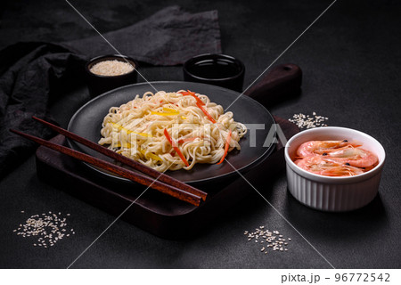 Delicious fresh rice noodles with shrimp, spices and herbs 96772542