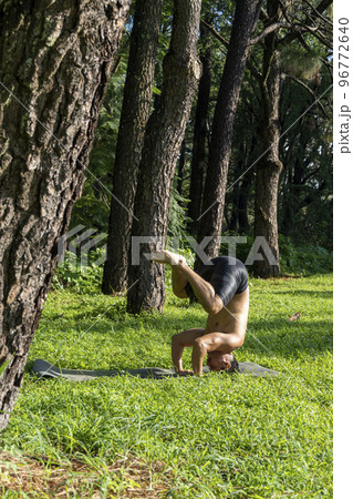 young man, doing yoga or reiki, in the forest very green vegetation, in mexico, guadalajara, bosque colomos, hispanic, young man, doing yoga or reiki, in the forest very green vegetation, in mexico, guadalajara, bosque colomos, hispanic, 96772640