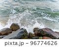The waves of the sea crash on the rocks. Big rocks on the shore. Stony seashore. 96774626