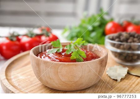 Delicious fresh tomato sauce on table, closeup Delicious fresh tomato sauce on table, closeup 96777253