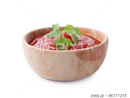 Tasty tomato sauce with parsley in wooden bowl isolated on white Tasty tomato sauce with parsley in wooden bowl isolated on white 96777255