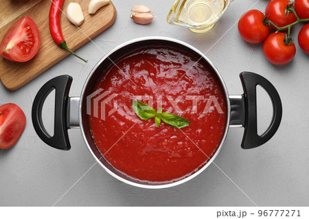 Delicious tomato sauce on light grey table, flat lay 96777271