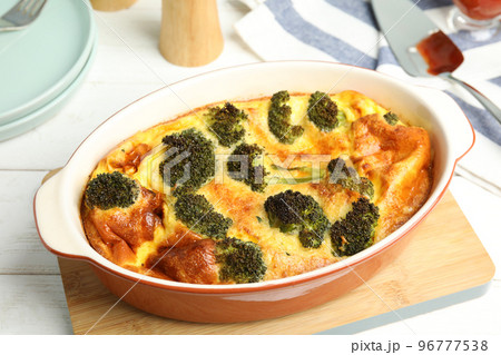 Tasty broccoli casserole in baking dish on white wooden table Tasty broccoli casserole in baking dish on white wooden table 96777538