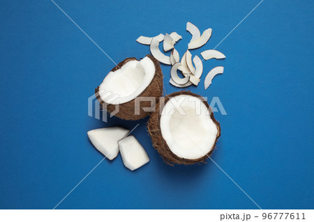 Flat lay composition with tasty coconut chips on blue background 96777611