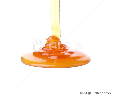 Pouring sweet fresh honey isolated on white 96777755