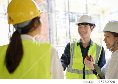 Male civil engineer having a conversation with his construction inspector and architect 96780920