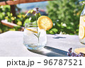 Cool lavender homemade lemonade with lemon slices and lavender flower. Healthy organic summer soda drink. Detox water. Diet unalcolic coctail. 96787521