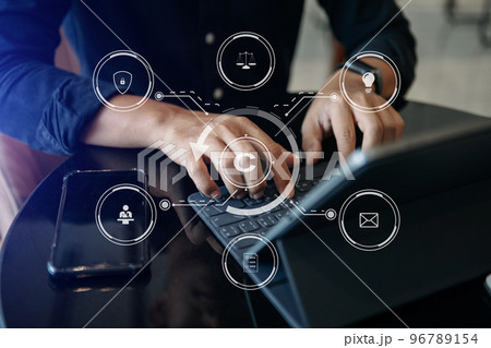 Copyright or patent concept, Business team analyzing data and using smart phone and tablet with virtual screen copyright icon trademark license, Creation ownership against piracy. 96789154