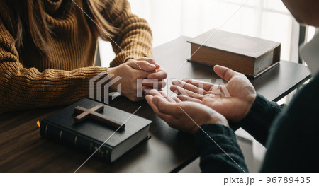 Christians are congregants join hands to pray and seek the blessings of God... Christians are congregants join hands to pray and seek the blessings of God... 96789435