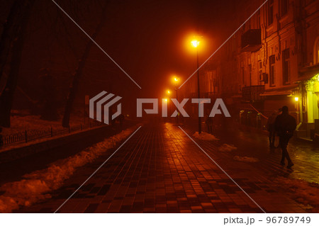 Night path with mystical red light. The city is in the fog. The effect of soft focus, sleep. Night path with mystical red light. The city is in the fog. The effect of soft focus, sleep. 96789749