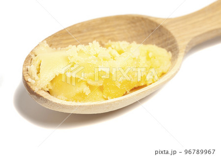 Ghee in wooden spoon isolated on white background,top view. 96789967