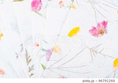 The Stack of different handmade paper with dry leaf and flower. The Stack of different handmade paper with dry leaf and flower. 96791260