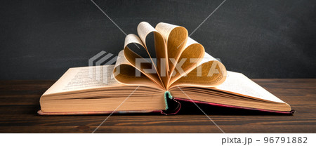 Old book on a wooden table. Learning and development concept 96791882