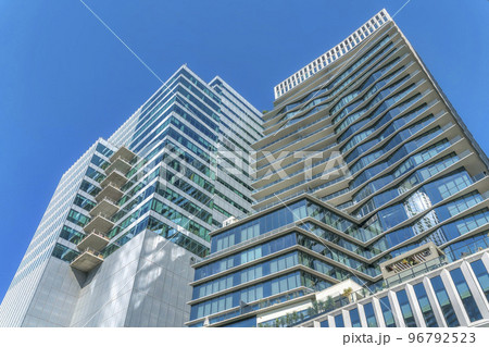 Austin, Texas- Low angle view of a modern high-rise buildings under the blue sky Austin, Texas- Low angle view of a modern high-rise buildings under the blue sky 96792523